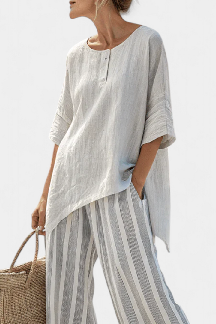 Fiorella – blusa asimétrica elegante y pantalones a rayas